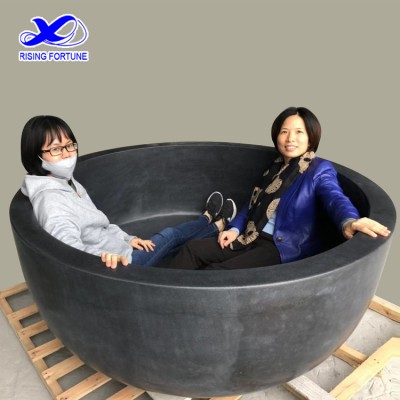 Custom made round freestanding honed black stone bathtub